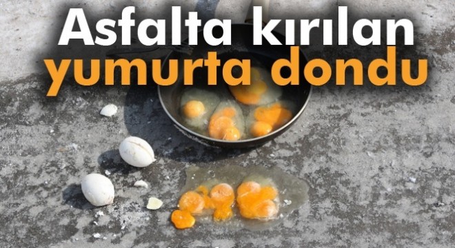 Asfalta kırılan yumurta soğuktan dondu