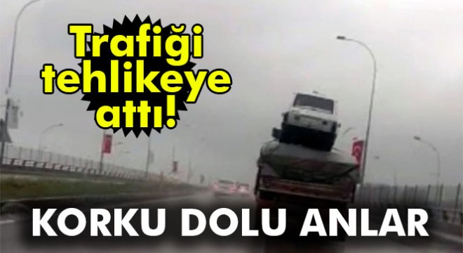Tırdaki yüklerin üzerinde otomobil taşıdı
